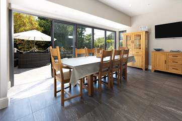 Folding doors open out onto the terrace, bringing the light and sunshine inside