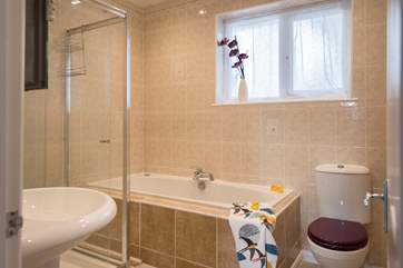 The family bathroom has a jacuzzi bath and separate shower cubicle.
