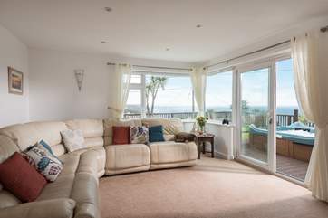 The sitting-area is light and bright, with a huge corner sofa.