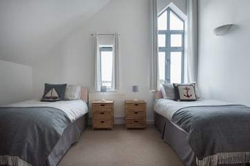 The twin room is at the opposite end of the hallway.
