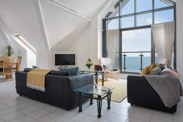 The fabulous open plan living space, the curtains have been removed to enhance the fabulous view.