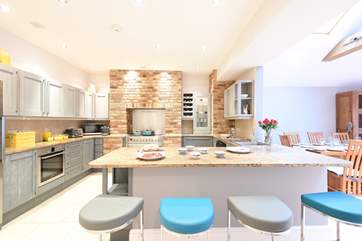 The kitchen-area has a sociable breakfast-bar.