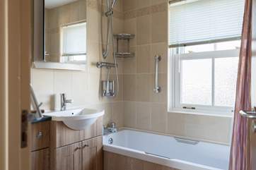 The family bathroom has a fitted shower above the bath.