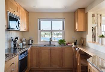 The kitchen-area shows the quality of the cottage, with birds eye maple units and granite work surfaces.