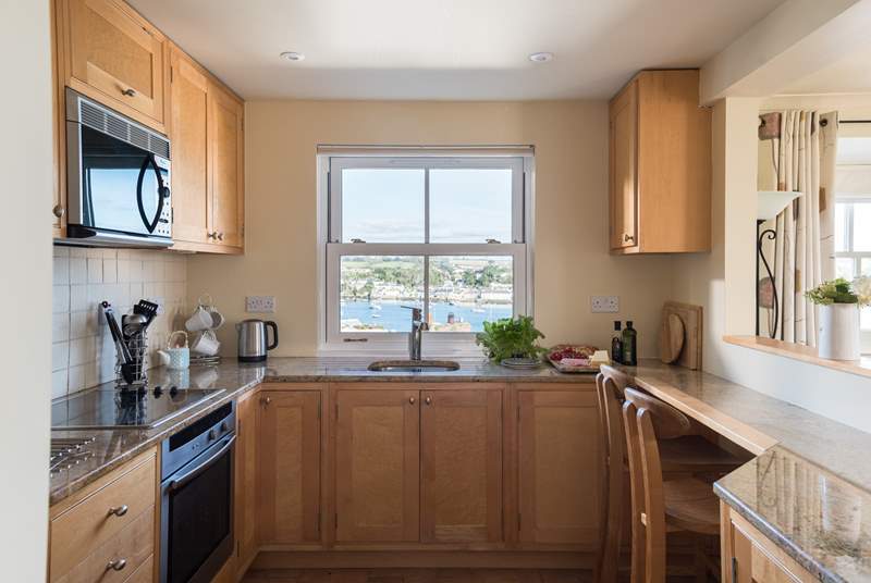 The kitchen-area shows the quality of the cottage, with birds eye maple units and granite work surfaces.