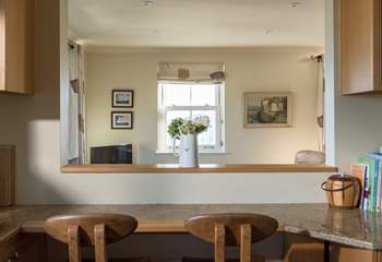 The breakfast-bar in the kitchen, complete with bespoke, locally-made chairs.