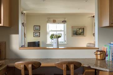 The breakfast-bar in the kitchen, complete with bespoke, locally-made chairs.