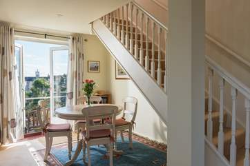 The dining area is next to the French doors that lead out to the sunny terrace.