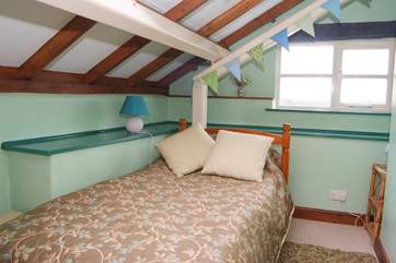 This is the single bedroom, with views across the open farmland.