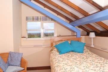 This bedroom can be set up as a single or as a twin room - there is a truckle bed with a proper mattress tucked beneath the bed in the photo.
