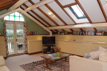 The beams are a reminder of the history of this barn conversion - take care where they are low, at the edges of the room.