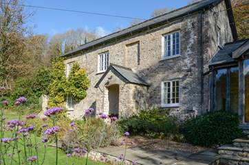 Beautiful wisteria adds to the character of this gorgeous cottage. It is in a very private setting.