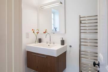 The en suite shower-room has a large cubicle and drench head shower.