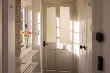 The ground floor cloakroom to your right with useful boot storage by the back door.