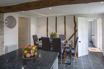 The dining-area of this delightful open plan space - the room to the left has a large fridge/freezer, washing machine and tumble-drier and lots of storage space.