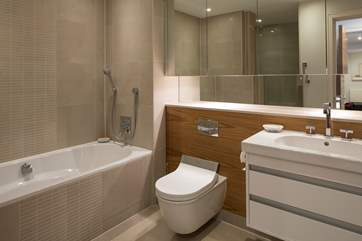 The en suite for the master bedroom is huge! It includes a bath with shower attachment along with a large shower cubicle.