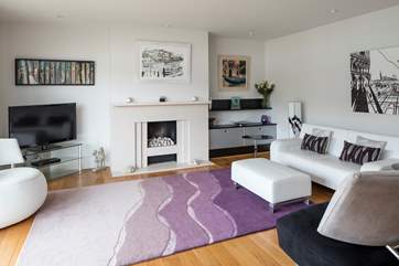 The sitting-room. Perfect for relaxing with a glass of something tasty. Please note the sofa has been upgraded, please see image 2. Please also note the pebble effect fireplace is decorative.