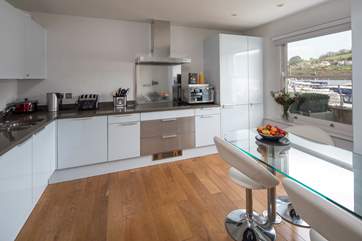 Even the kitchen boasts an amazing view and offers all mod-cons and is fully equipped.