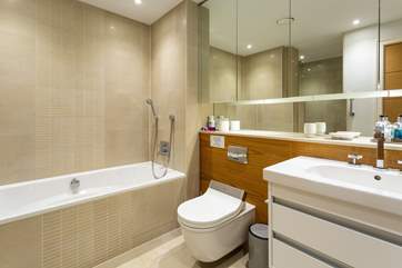 The en suite for the master bedroom is huge! It includes a bath with shower attachment along with a large shower cubicle.