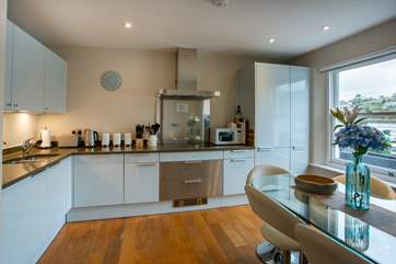 Even the kitchen boasts an amazing view and offers all mod-cons and is fully equipped.