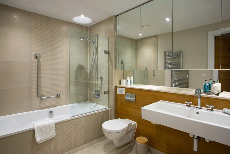 The en suite for the master bedroom is huge! It includes a bath with shower attachment along with a large shower cubicle.