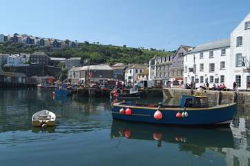 Fishing boats unload their catches at the quay in Mevagissey.
