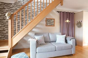 Open-tread steps (take care) allow light into the living-room.
