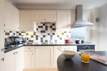 The kitchen-area in the open plan living-room. The fridge has a handy ice box, perfect for those holiday drinks!