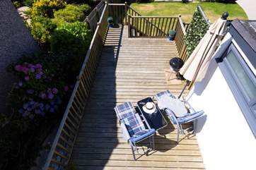 Looking down from the bedroom window over the garden and decking.