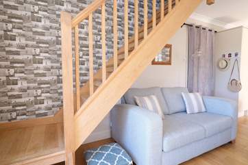Open-tread steps (take care) allow light into the sitting-room.