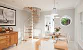 The spiral staircase is a beautiful feature in the  sitting/dining-room. - Thumbnail Image