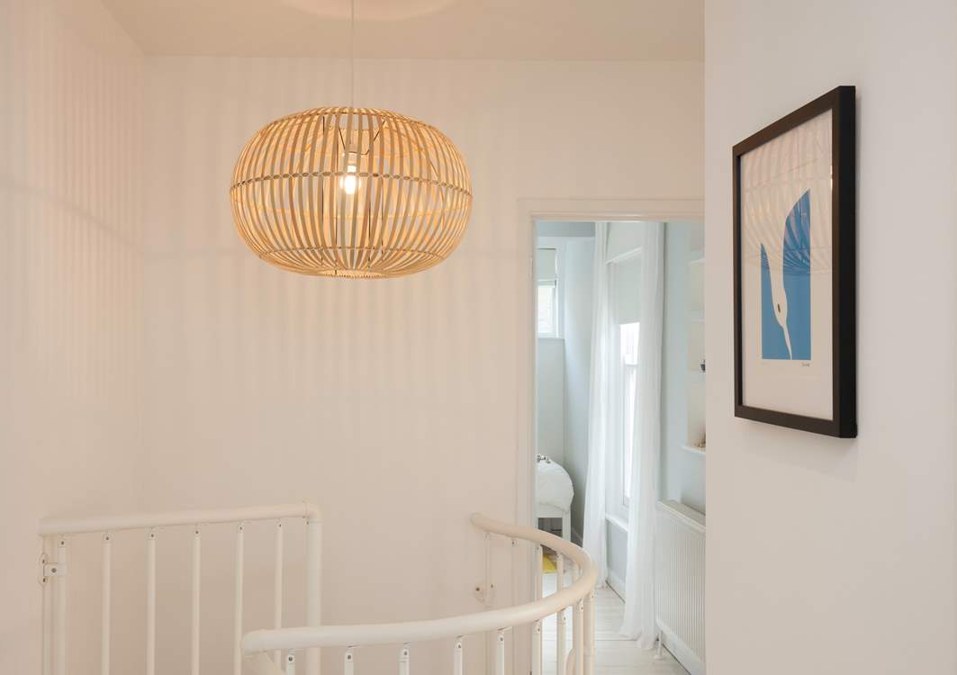 The spiral staircase leads to three lovely bedrooms on the first floor.