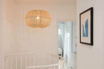 The spiral staircase leads to three lovely bedrooms on the first floor.