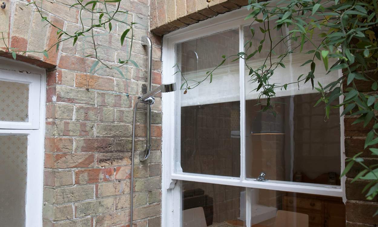 After a day on the beach, wash away the sand using the convenient outdoor shower.