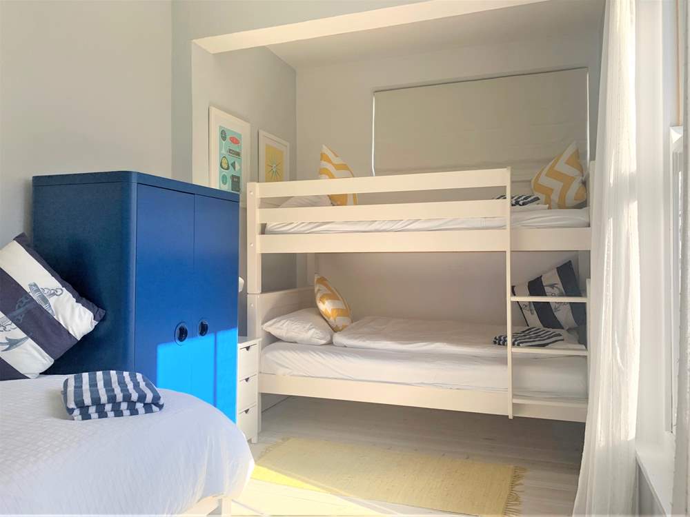 The bunk-bed room with single bed on the first floor.