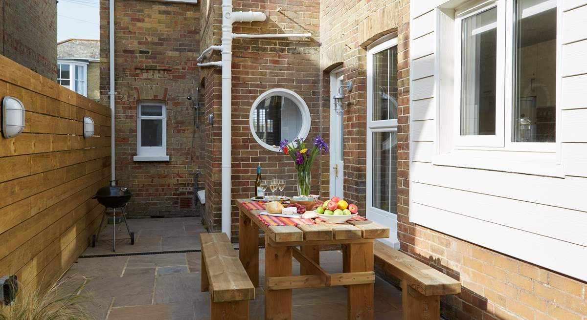 The delightful rear patio is perfect for al fresco dining.