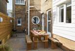 The delightful rear patio is perfect for al fresco dining.