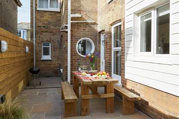 The delightful rear patio is perfect for al fresco dining.