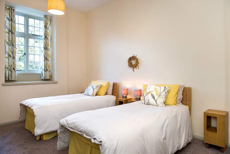 The pretty twin bedroom on the ground floor - perfect for adults or children alike.