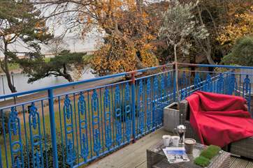 The split-level decking has outdoor sofas to relax on with your morning coffee, just before you take a dip in hot tub!
