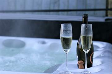 Relax and unwind in the hot tub set on the balcony.