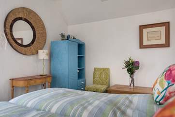 This pretty bedroom can be made up as a king-size double bed or as two 2' 6'' single beds.