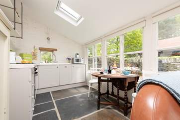 The kitchen is beautifully designed with creative touches added by the owner, such as the shelving - a nod to The Apple Store's past.