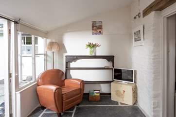 The sweet sitting-area has toasty under-floor heating, making it the ideal place to snuggle up after a day out and about.