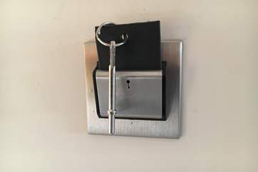 The key card needs to be inserted in the slot, just inside the front door, to activate the lighting in the cottage.