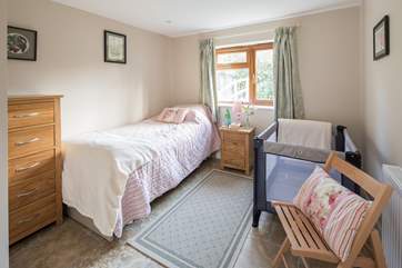 In the twin room, one bed can be stored beneath the other to make room for the travel cot.