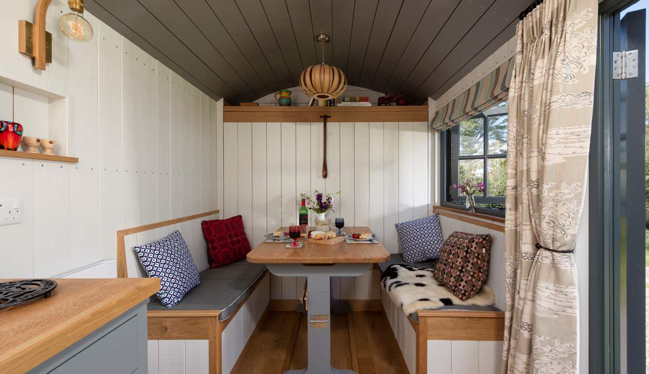 The cleverly-designed table and benches convert with ease into the comfy double bed.