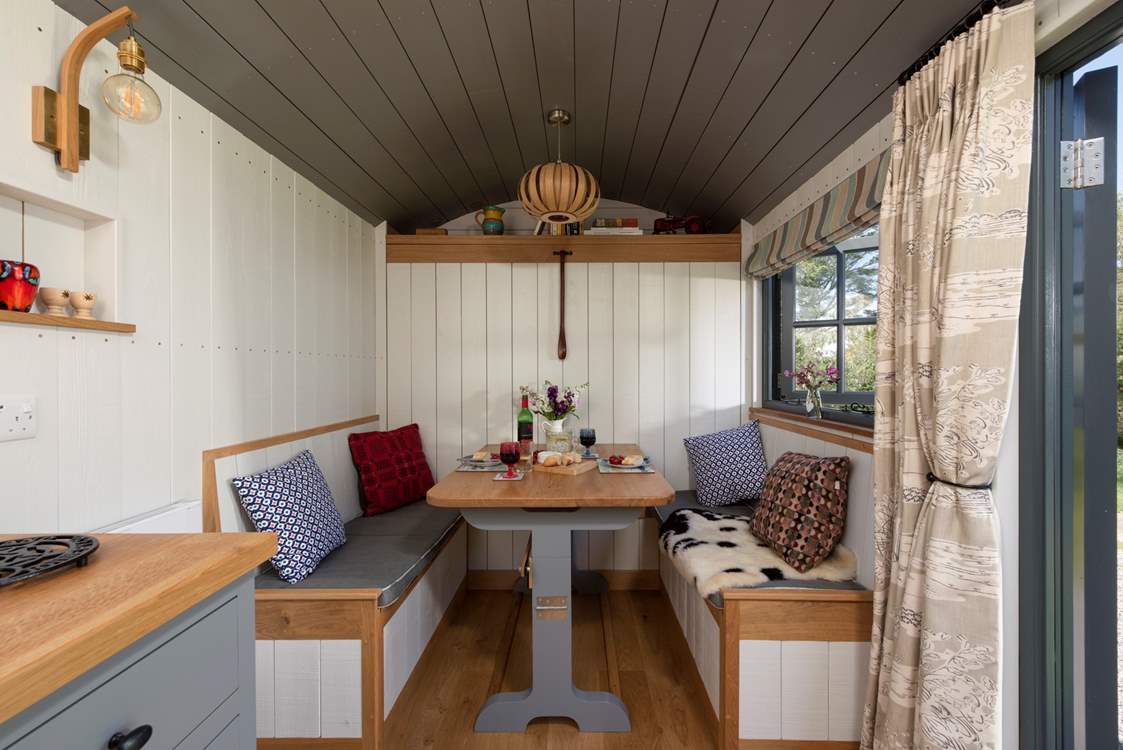 The cleverly-designed table and benches convert with ease into the comfy double bed.