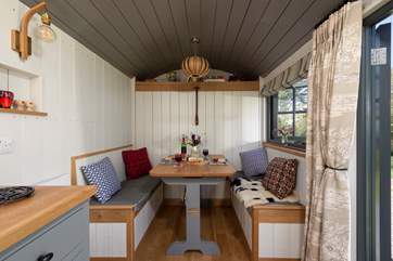 The cleverly-designed table and benches convert with ease into the comfy double bed.