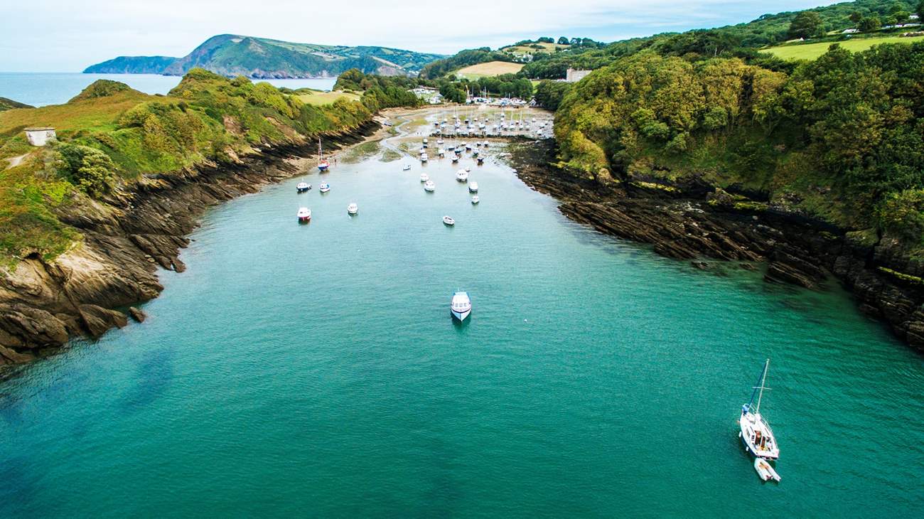 The beautiful natural harbour at Watermouth Bay lies at the foot of the hill that rises up to Lydford Farm, the setting for Wild Pear Shepherds' Hut.